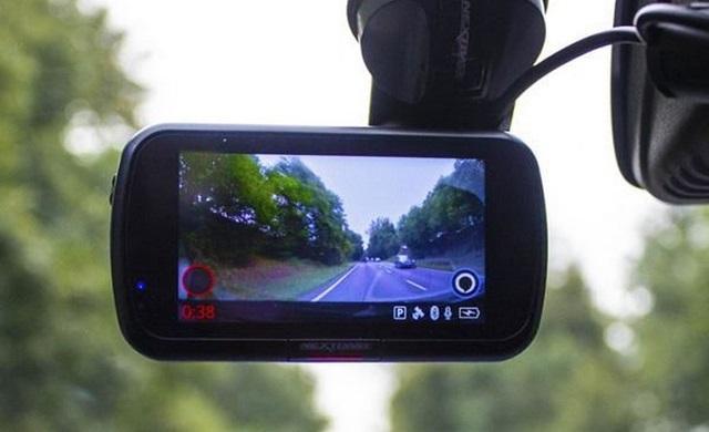 A picture containing tree, car mirror, mirror Description automatically generated